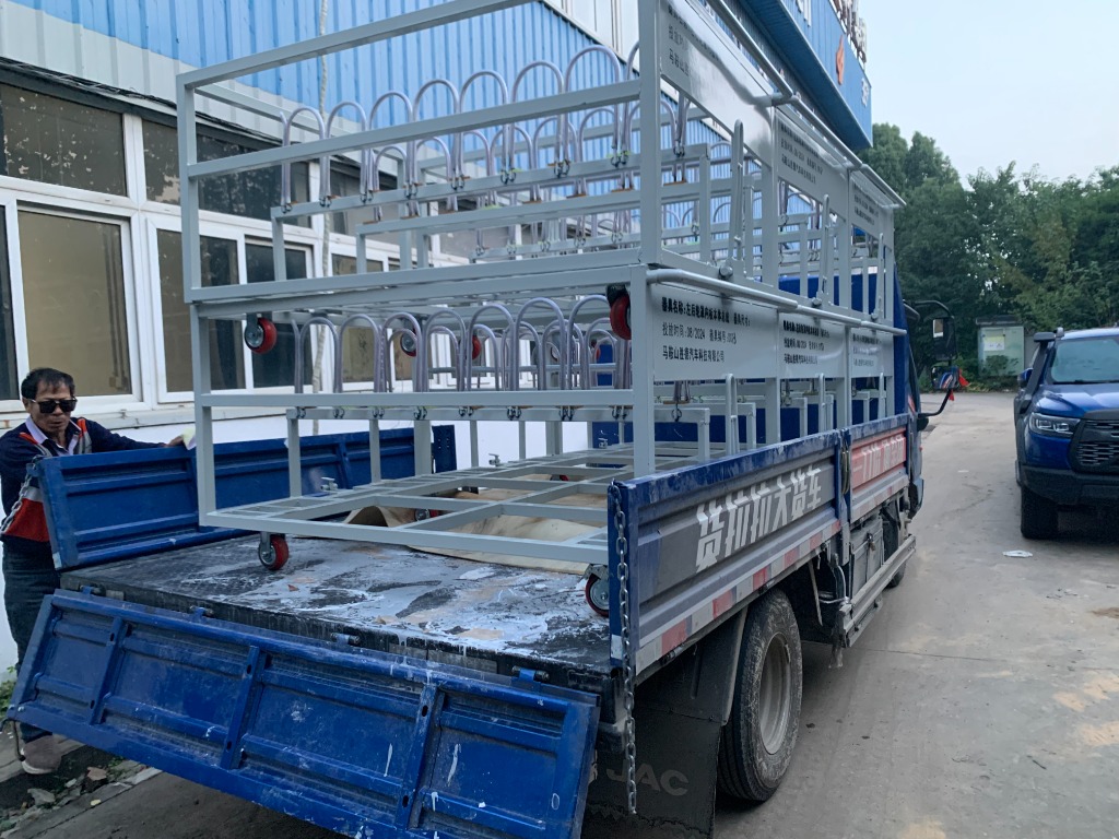 Grey custom parts trolley loaded on a shipping truck at Ma'anshan Automotive Parts factory