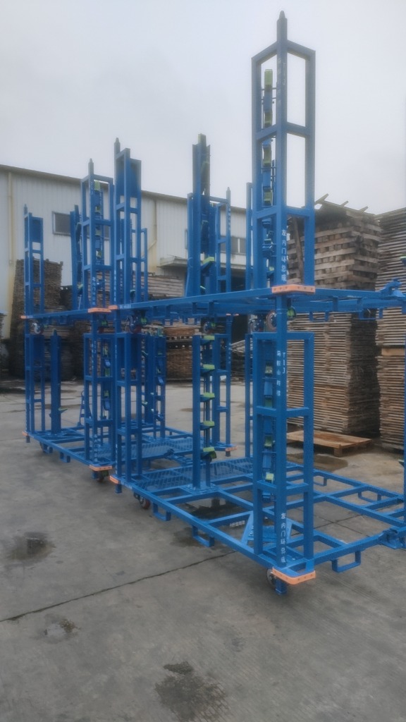 Custom tall blue stackable automotive parts rack standing in the factory yard for testing
